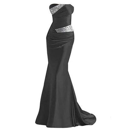 Elegant beaded mermaid evening dress in black with stylish side embellishments for formal occasions