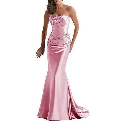 Elegant pink beaded mermaid evening dress with a strapless design and fitted silhouette