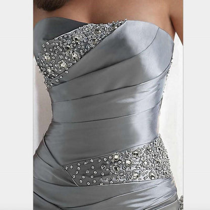 Elegant beaded mermaid evening dress with silver satin and intricate bead detailing