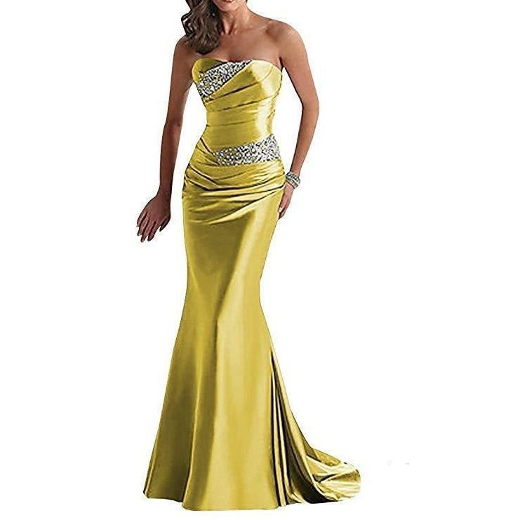 Stunning beaded mermaid evening dress in yellow with a strapless design and elegant draping