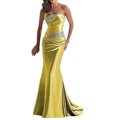 Stunning beaded mermaid evening dress in yellow with a strapless design and elegant draping