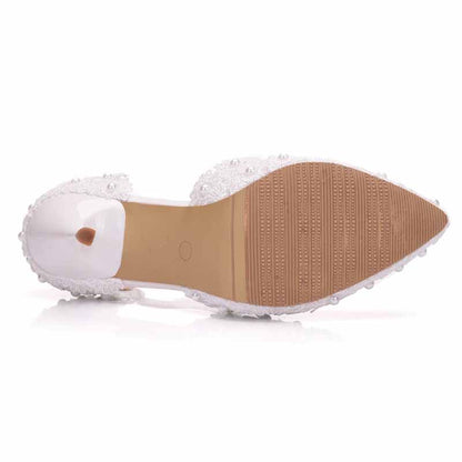 bridal closed toe high heel sandals with a decorative beaded design and a clear heel