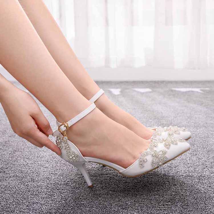 Elegant bridal crystal heels for wedding with delicate embellishments and ankle straps