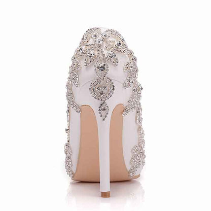 Elegant bridal rhinestone high heel pumps with intricate detailing and a sleek silhouette