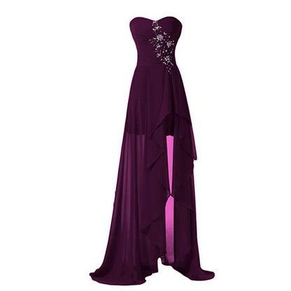 Elegant strapless bridesmaid dress long in deep purple with a flowing skirt and sparkling details