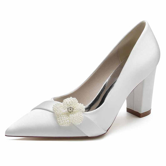 Elegant white chunky heel bridal pumps with a floral embellishment for a stylish wedding look
