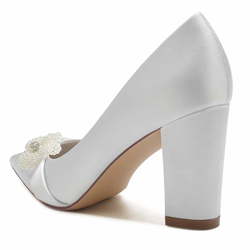 Elegant white chunky heel bridal pumps with beaded floral decoration for a stylish wedding look