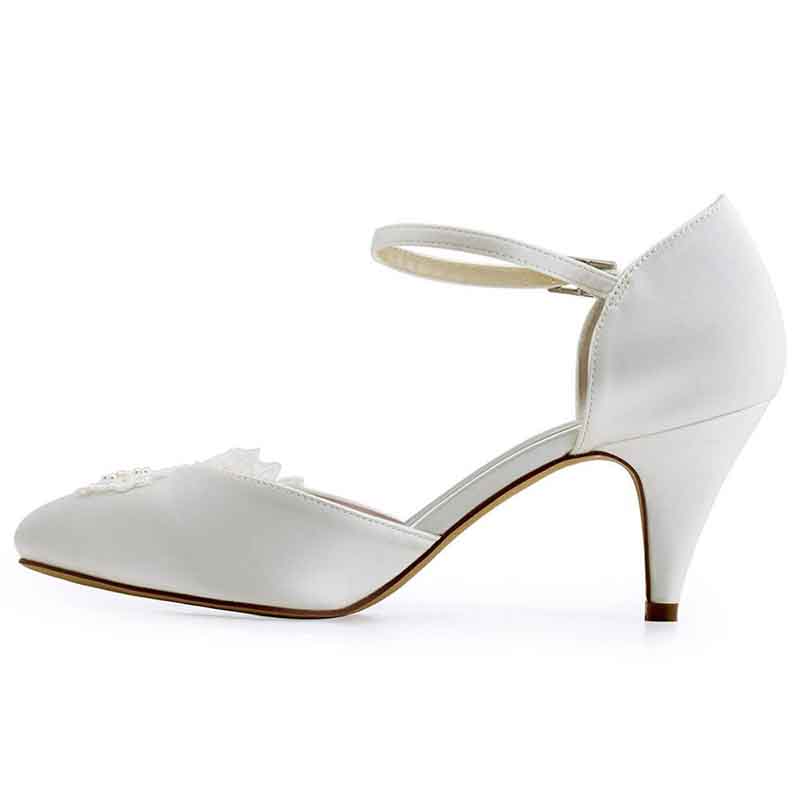 Elegant closed toe bridal shoes low heel with delicate straps and adornments for a perfect wedding look