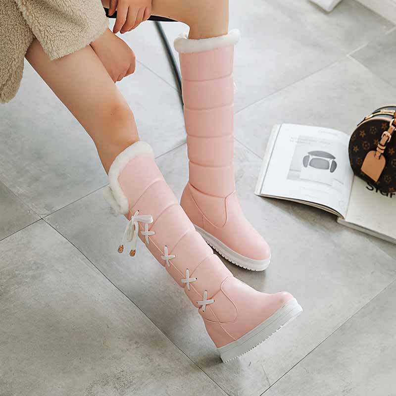Cute winter boots for women in pink with fur lining and stylish design for cold weather