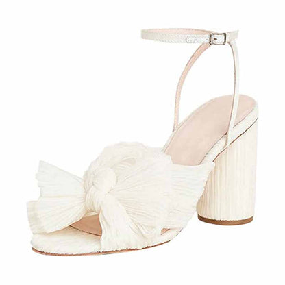 Elegant bridal bow knot heeled sandals with a stylish ankle strap and textured design