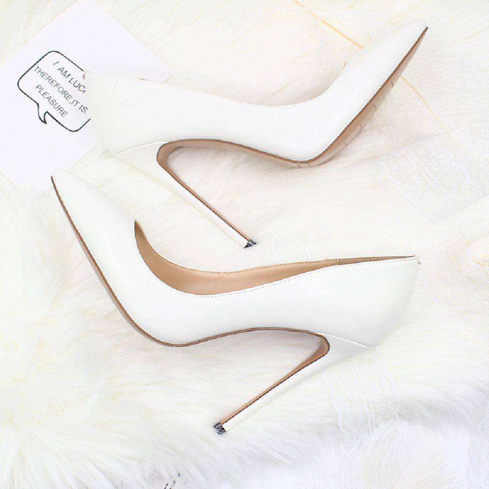 Stylish white elegant high heel shoes for weddings with sleek pointed design and stiletto heels