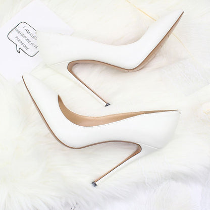 Stylish white elegant high heel shoes for weddings with sleek pointed design and stiletto heels