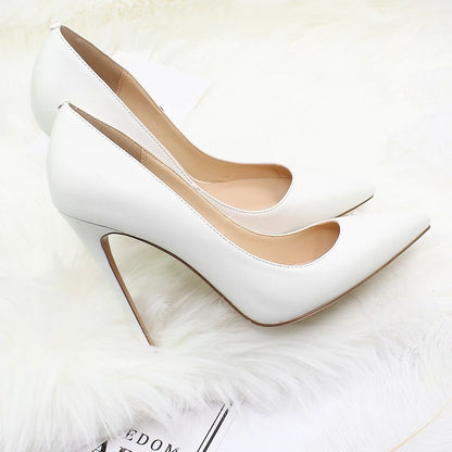 Elegant high heel shoes for weddings in white with a sleek pointed toe design