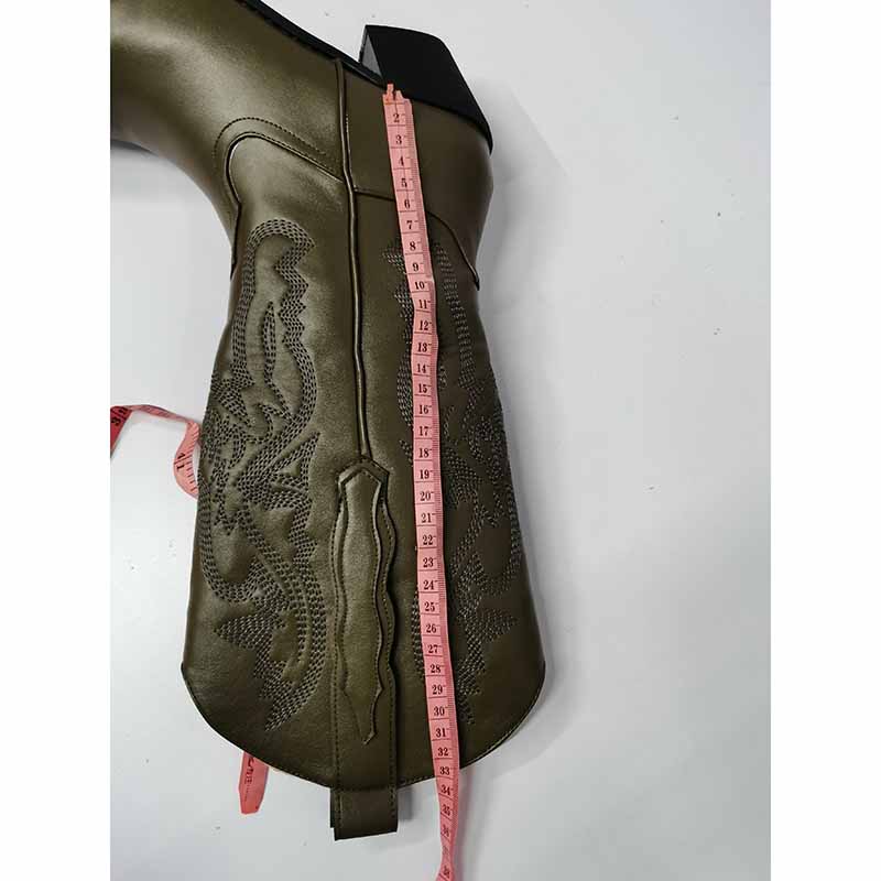 Embroidered cowgirl boots wedding in olive green with intricate detailing and measuring tape for size reference