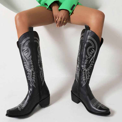 Tucomosi embroidered cowgirl knee high boots in black with intricate stitching and a pointed toe design