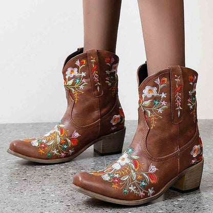 Embroidered western ankle boots for women featuring colorful floral designs and a stylish heel