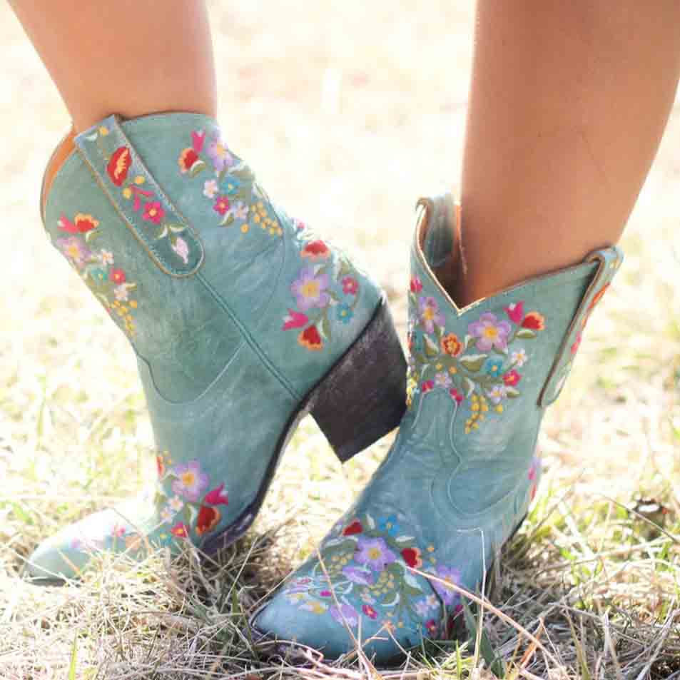 Embroidered western blue ankle boots for women with colorful floral designs and a stylish heel