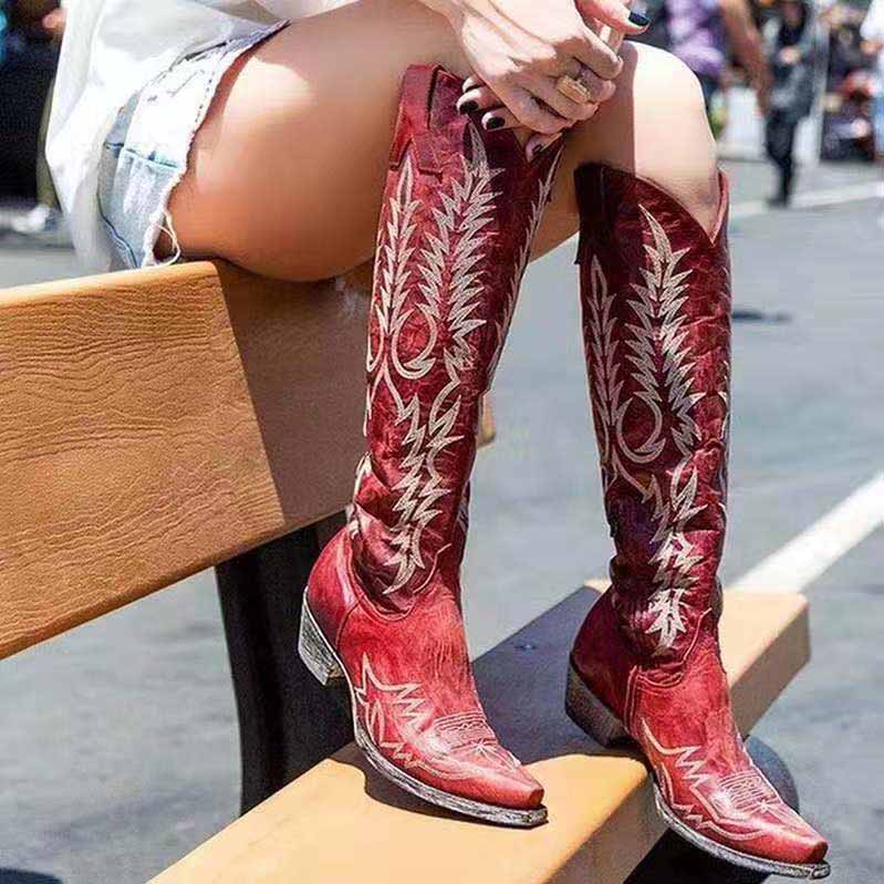 Red embroidered western boots for women with intricate leaf designs and pointed toes, perfect for stylish outfits