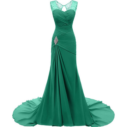 Elegant green evening long dresses for weddings with a fitted bodice and flowy train