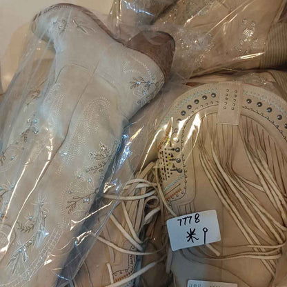 Floral embroidery wedding boots in beige with intricate detailing and elegant design for brides