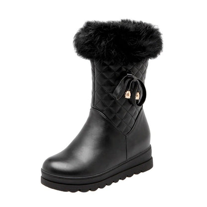 Black S&DCo. fur lined waterproof boots for girls with quilted design and ribbon detail