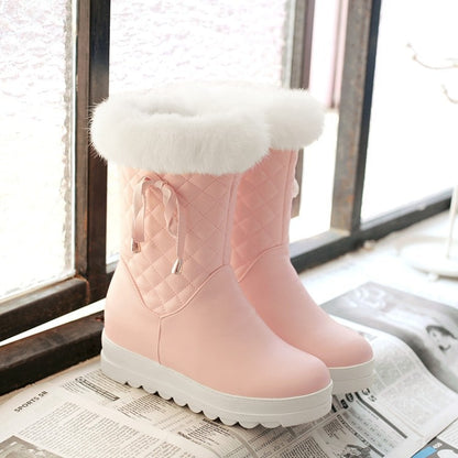 Pink fur lined waterproof boots for girls with a cozy, quilted design and a fluffy cuff