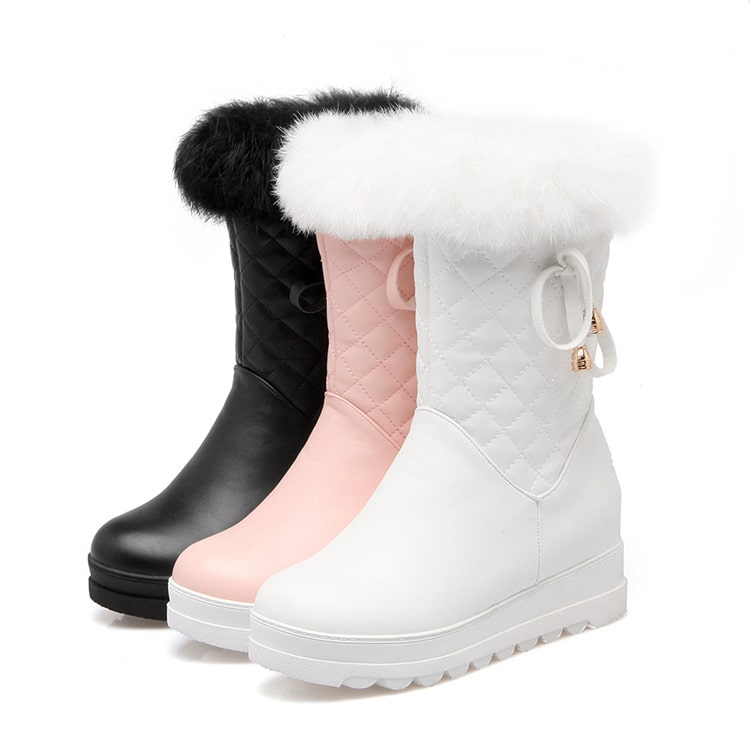Fur lined waterproof boots for girls in black, pink, and white with stylish design and cozy fur trim