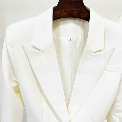 Elegant white high waisted wedding pantsuit by Tucomosi with a stylish lapel collar