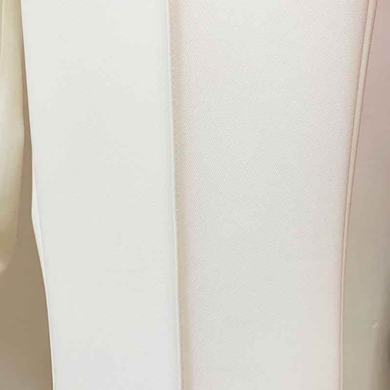Elegant high waisted wedding pantsuit by Tucomosi in soft white fabric, perfect for modern brides