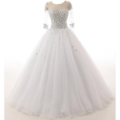 S&DCo. jewel neck satin tulle bride dress with crystal embellishments and flowing skirt
