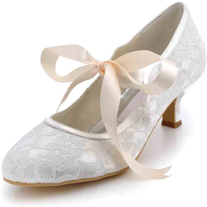 Elegant lace wedding shoes for bride with ribbon detail and a stylish heel