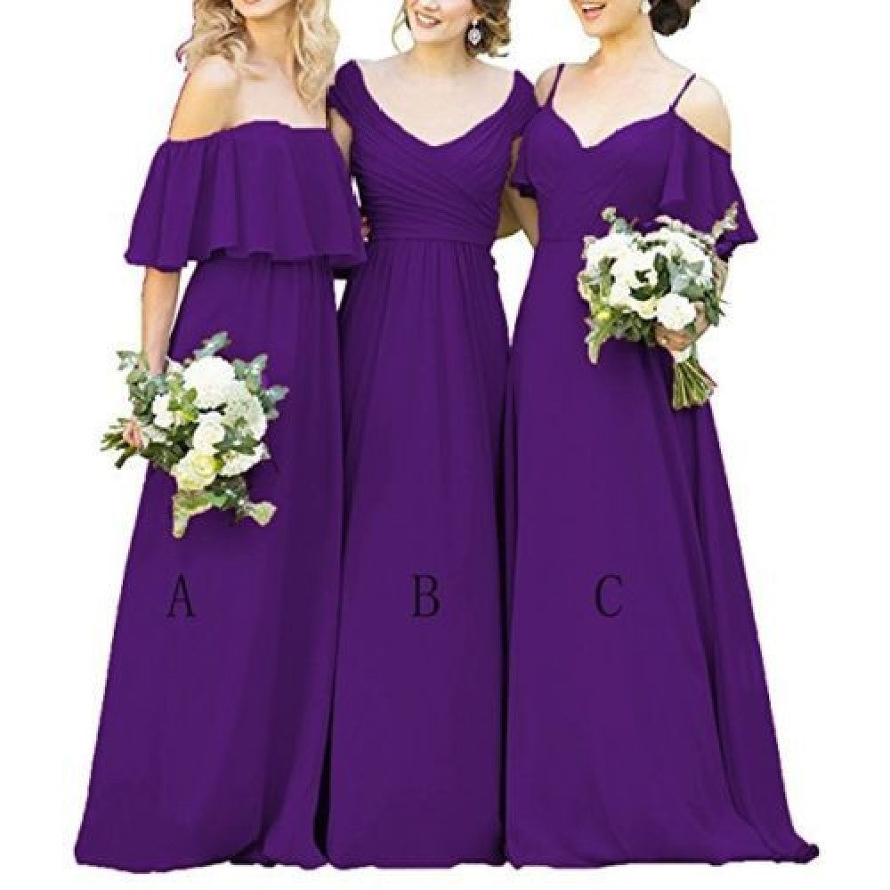 Three women in long chiffon bridesmaid dresses in purple with floral bouquets for weddings
