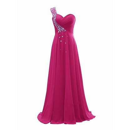 Pink bridesmaid dress with one shoulder and embellishments, ideal as a long evening gown for weddings