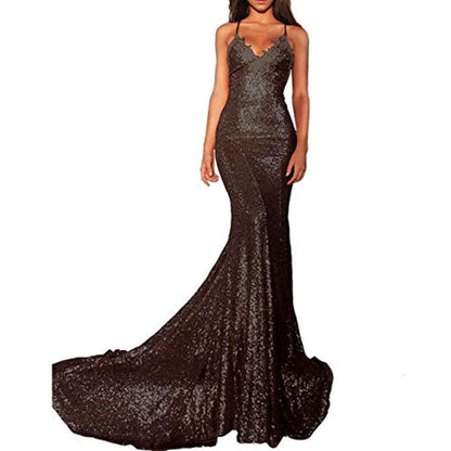 Elegant black mermaid sequin prom dress with spaghetti straps and a dramatic train