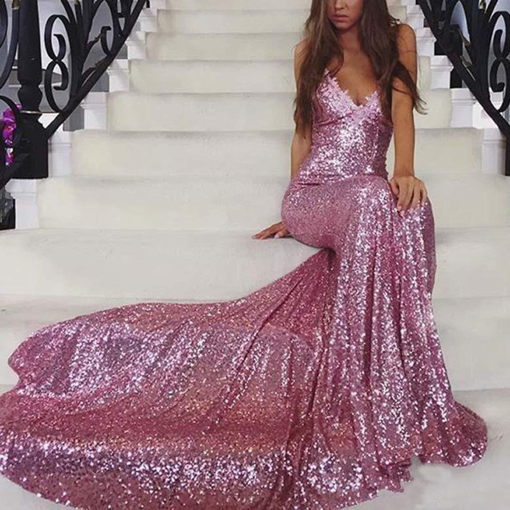 Stunning mermaid sequin prom dress in pink, featuring a form-fitting design and elegant train.
