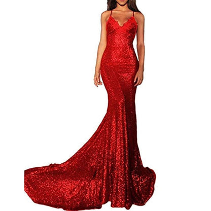 Stunning red mermaid sequin prom dress with a fitted bodice and flowing train