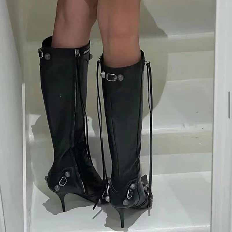 Stylish black metal embellished fashion boots with high heels and unique detailing on the back