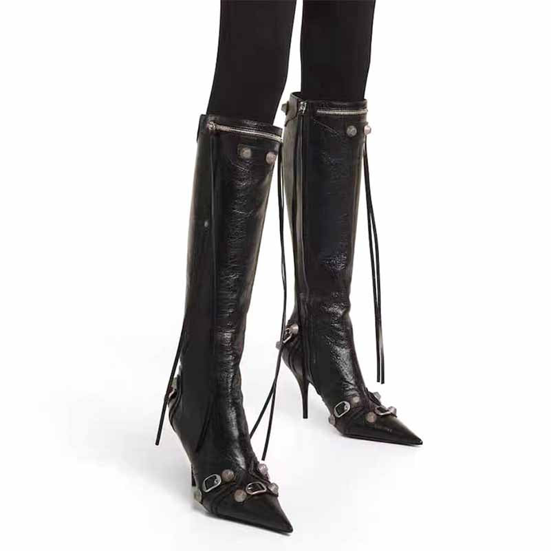 Stylish metal embellished fashion boots with pointed toes and decorative straps for a chic look