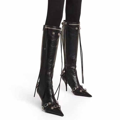 Stylish metal embellished fashion boots with pointed toes and decorative straps for a chic look