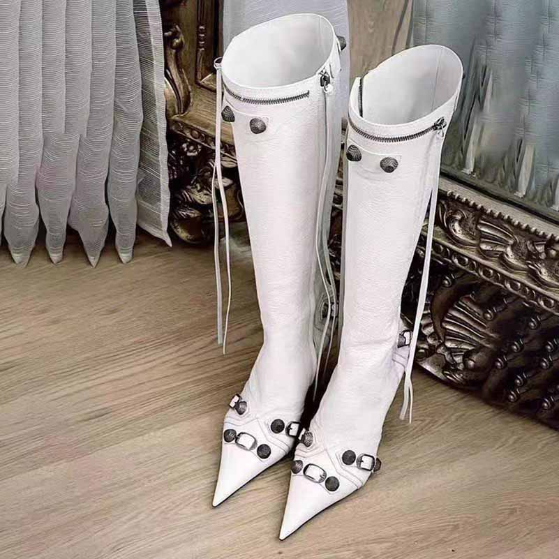 White metal embellished fashion boots with pointed toes and zipper details for stylish looks