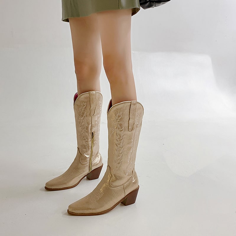 Stylish metallic cowgirl boots for women with intricate stitching and a pointed toe design