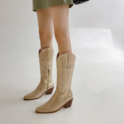Stylish metallic cowgirl boots for women with intricate stitching and a pointed toe design