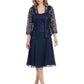 Elegant mother of the bride lace dress with jacket in navy, featuring a flowing skirt and three-quarter sleeves