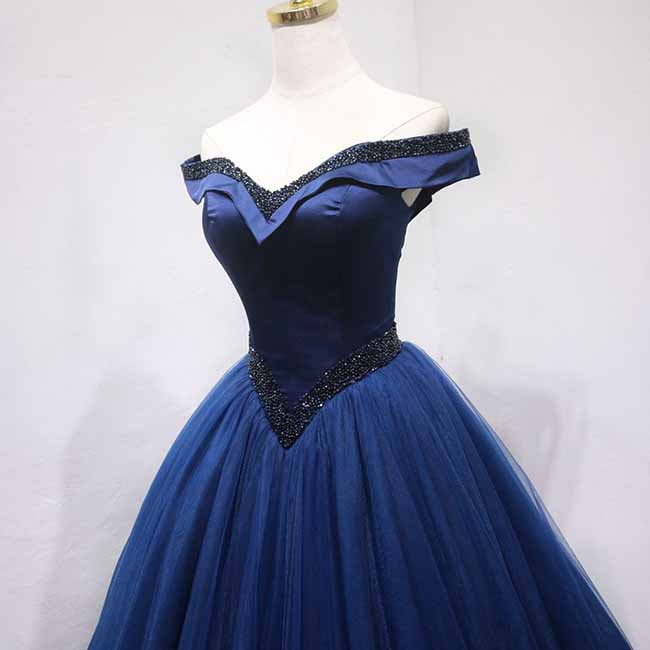 Elegant off the shoulder ball gown prom dress in navy blue with a fitted bodice and full tulle skirt