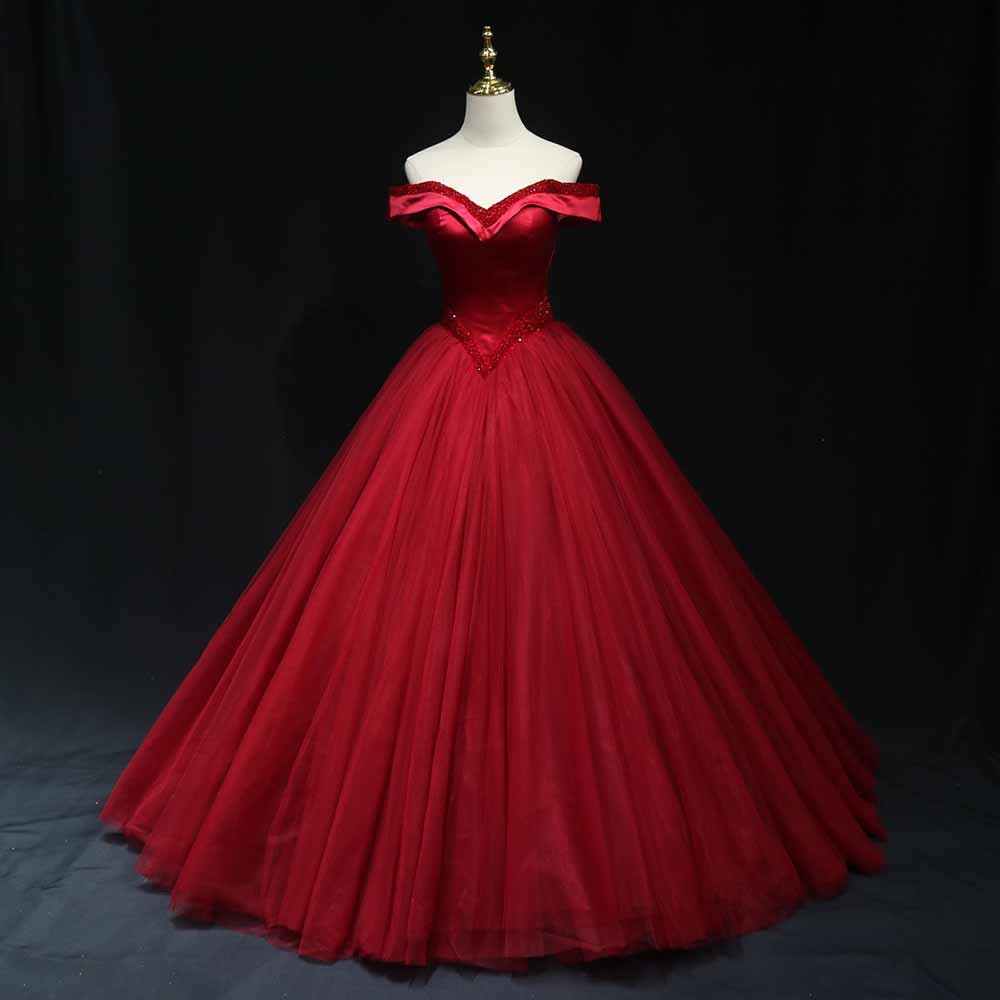 Elegant red off the shoulder ball gown prom dress with a flowing tulle skirt and sweetheart neckline