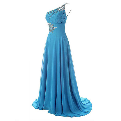 Blue one shoulder ombre prom dress with rhinestone embellishments and flowing skirt