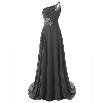 Elegant black one shoulder ombre prom dress with jeweled detailing and flowing skirt