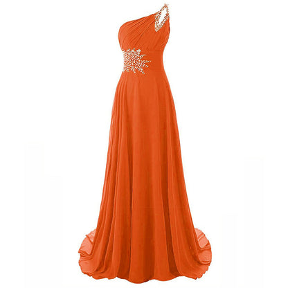 Elegant orange one shoulder ombre prom dress with jeweled detailing and flowing skirt