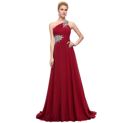 Elegant one shoulder ombre prom dress in deep red with silver embellishments and flowing skirt
