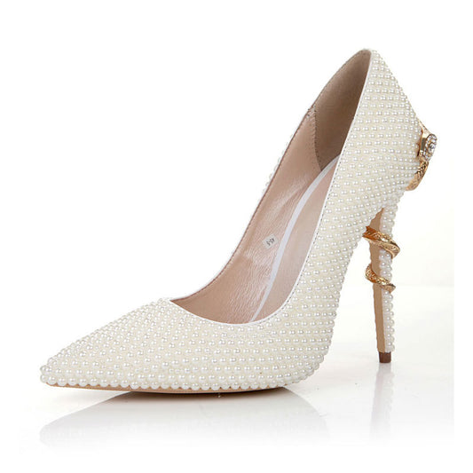Tucomosi pearl embellished pointed toe pumps in white with a stylish stiletto heel